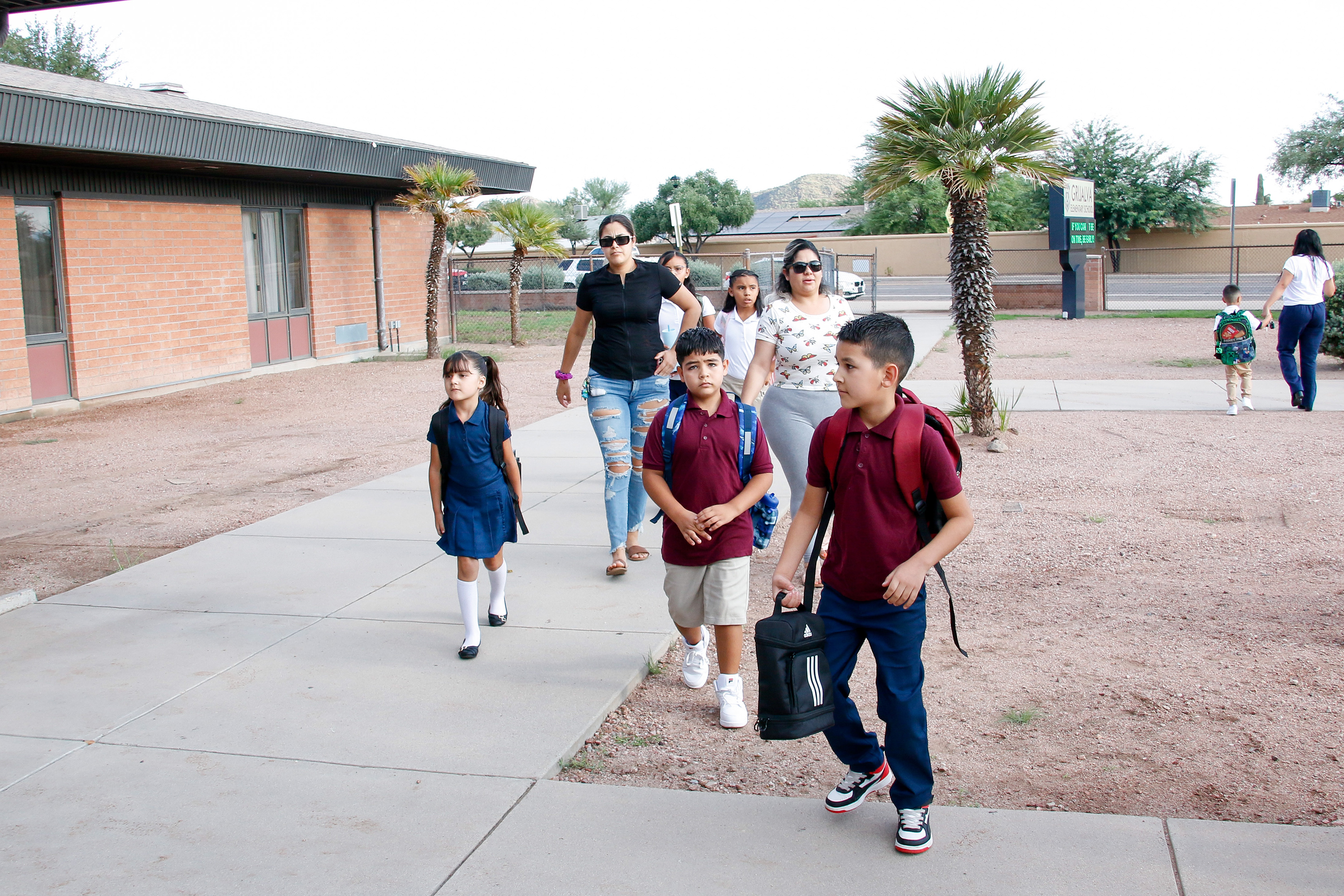 Students and their parents walk into Grijalva on the first day